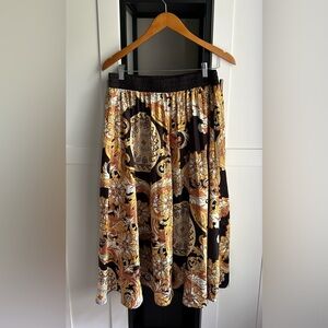Black & gold printed skirt. By CQ size L.